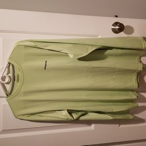 Long sleeve light green shirt.